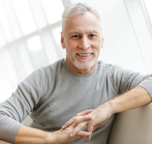 Patient smiling after dental bridge treatment in Carthage