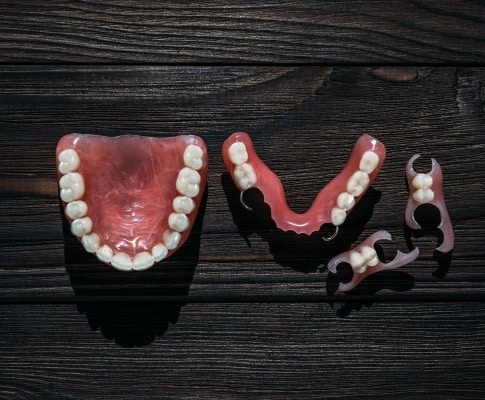 Full and partial dentures used to replace missing teeth in Carthage