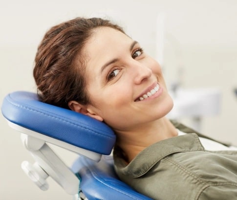 Smiling patient with healthy gums after professional dental care in Carthage