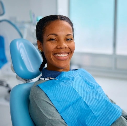 Patient receiving comfortable periodontal care in dental clinic in Carthage