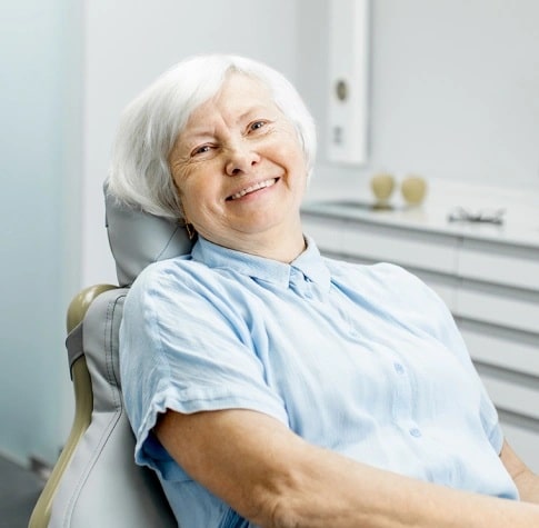 Patient after root canal therapy showing relief from tooth pain in Carthage