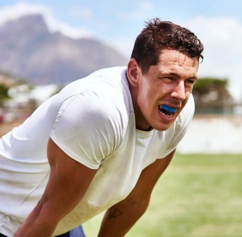 Athlete wearing a protective mouth guard during sports activity in Carthage